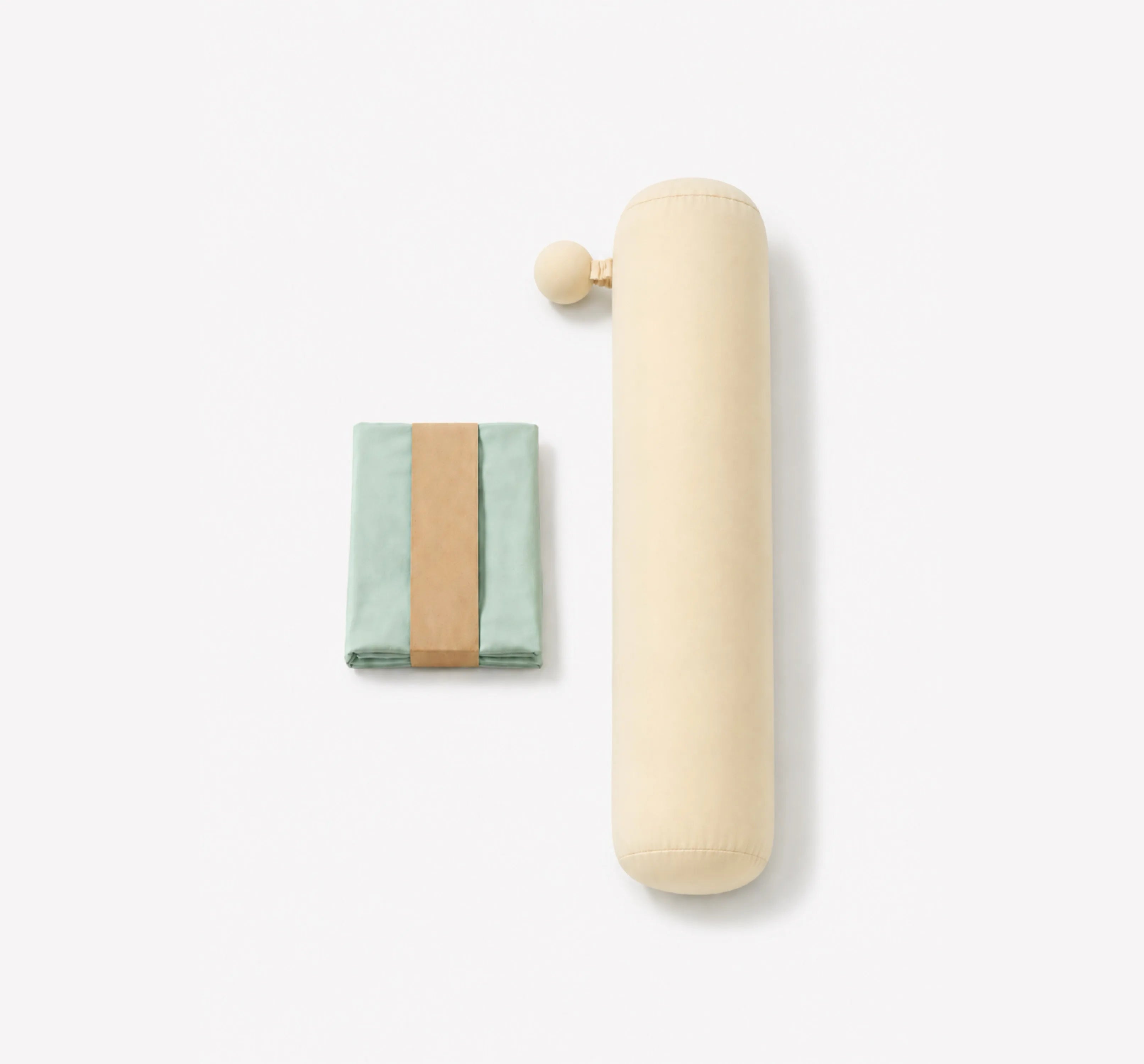 Beside body pillow with Palm Pod and a folded removable pillow cover